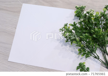 Mockup card with plants. invitation card with environment and details Mockup with postcard and flowers on white background 71765981