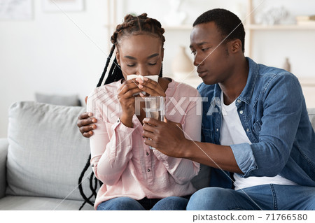 Emotional Breakdown. Caring Black Husband Comforting Crying Wife At Home Emotional Breakdown. Caring Black Husband Comforting Crying Wife At Home 71766580