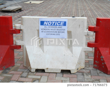 KUALA LUMPUR, MALAYSIA -JUNE 27, 2020: Plastic jersey barrier is a modular barrier that is temporarily used to reroute traffic and protect pedestrians while construction is underway.  71766873