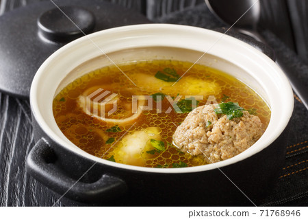 Rindsuppe Traditional Soup From Vienna, Austria close-up in a saucepan. horizontal Rindsuppe Traditional Soup From Vienna, Austria close-up in a saucepan. horizontal 71768946