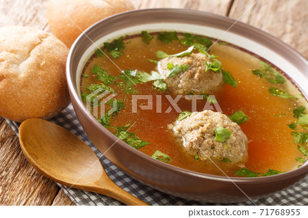 Homemade German broth with liver dumplings close-up in a plate. horizontal Homemade German broth with liver dumplings close-up in a plate. horizontal 71768955
