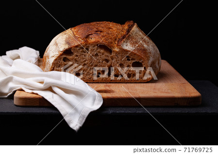 Artisan sourdough bread. on the black background. Artisan sourdough bread. on the black background. 71769725