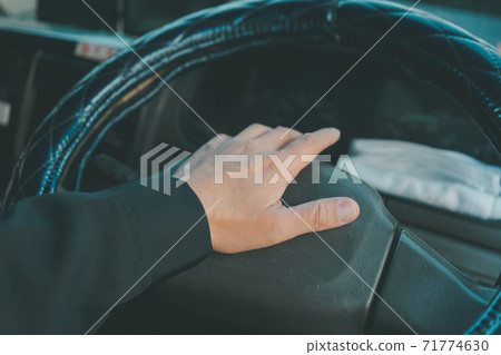 Truck driver honking Truck driver honking 71774630