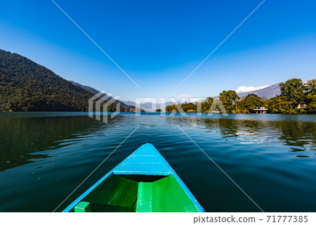 Canoe in the lake of Pokhara on Nepal Canoe in the lake of Pokhara on Nepal 71777385