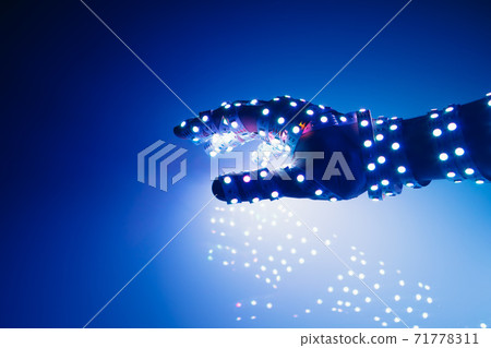 human hand covered with blue led lights, illuminated background 71778311