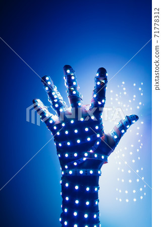 human hand covered with blue led lights, illuminated background human hand covered with blue led lights, illuminated background 71778312