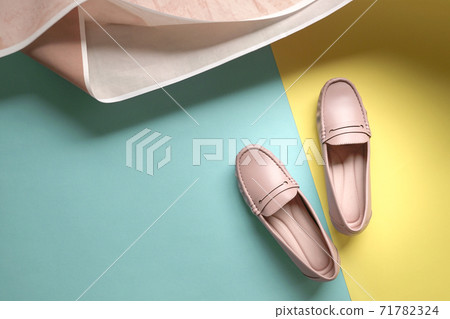 Stylish women shoes on yellow and blue background 71782324