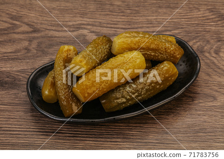 Pickled cucumbers in the plate Pickled cucumbers in the plate 71783756