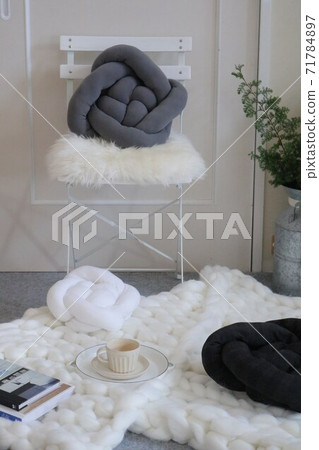 Coffee time in the living room with a monochrome interior in winter 71784897