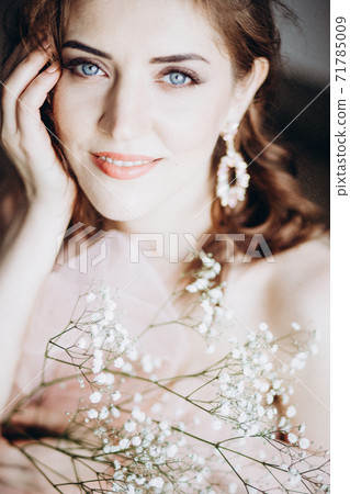 Romantic portrait of a young girl with blue eyes Romantic portrait of a young girl with blue eyes 71785009