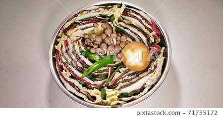 A pot with sesame leaves of beef cabbage. Delicious hot pot. A pot with sesame leaves of beef cabbage. Delicious hot pot. 71785172
