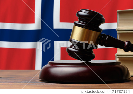 Justice and court concept in Kingdom of Norway. Judge hammer on a flag background 71787134