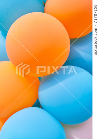 Multicolored balls as a background or texture in blue and orange colors Multicolored balls as a background or texture in blue and orange colors 71787159