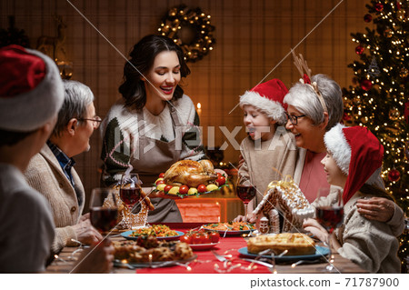 family celebrating Christmas 71787900