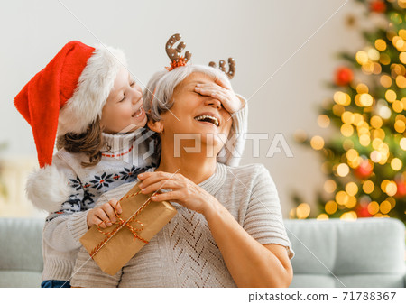 family celebrating Christmas 71788367
