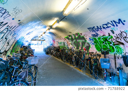 Bicycle parking lot under the elevated bicycle full of graffiti by spraying in Shibuya-ku, Tokyo 71788922