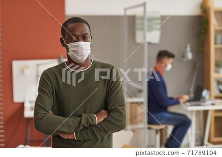 African-American Man Wearing Mask in Office 71789104