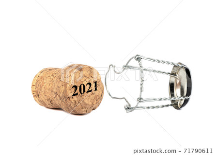 Separated champagne cork and muselet isolated on white background. Separated champagne cork and muselet isolated on white background. 71790611