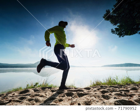 Outddor run. Healthy lifestyle man doing morning training 71790952