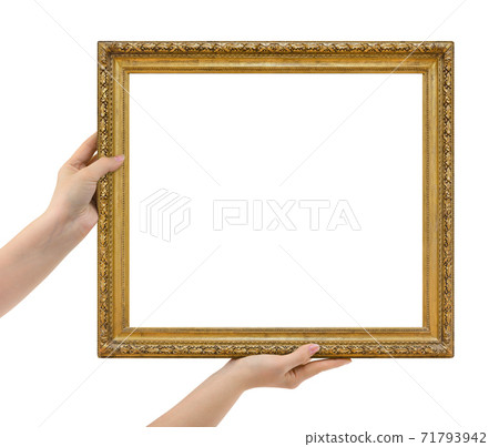 Wooden picture frame in hands 71793942