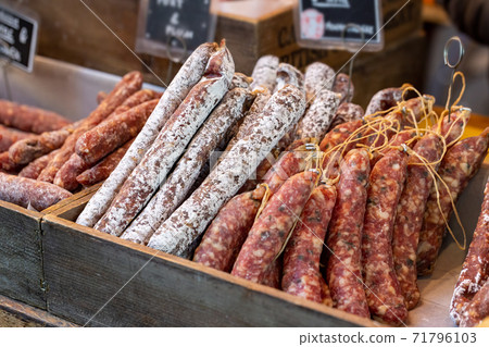 Gourmet chorizo sausages on display on a market stall 71796103