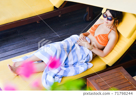 Woman in swimsuit at the resort 71798244