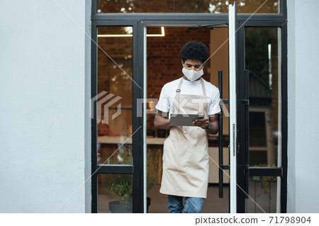 New normal, social distancing and online takeaway coffee during covid-19 quarantine in modern cafe 71798904