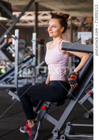 Portrait of young sporty woman in the gym 71800213