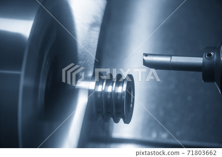 The  CNC lathe machine bore cutting the metal pulley parts.  71803662