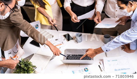 Working late, interracial asian business team brainstorm idea meeting Panorama. 71803946