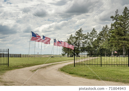 American flags on a rural cemetery American flags on a rural cemetery 71804943