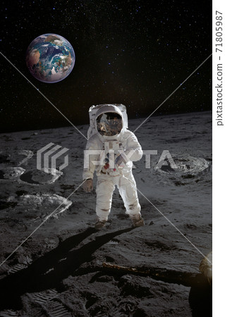 Astronaut on the moon surface with planet Earth behind 71805987