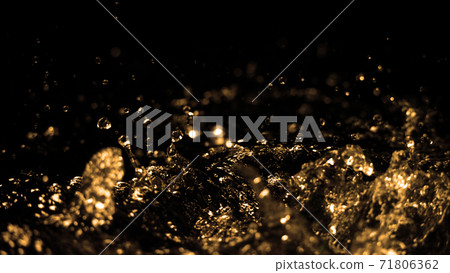 Hi speed close up images of oil liquid from diesel gasoline splashing and moving up to the air on black background for represent power of fuel liquid that active and powerful.  71806362