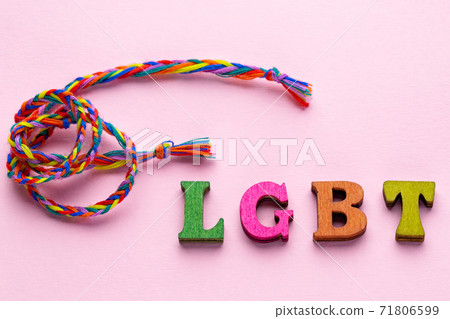 LGBT colorful lettering on pink background. LGBTQ rights concept LGBT colorful lettering on pink background. LGBTQ rights concept 71806599