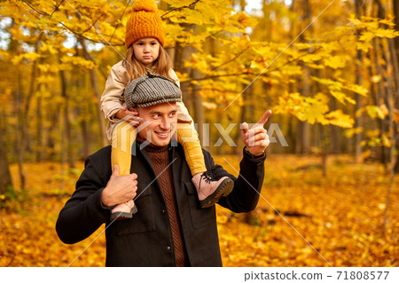 outdoor autumn portrait of father and daughter in the forest 71808577