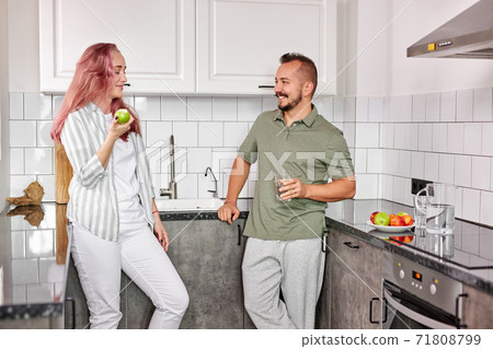 caucasian married couple have talk in the kitchen caucasian married couple have talk in the kitchen 71808799