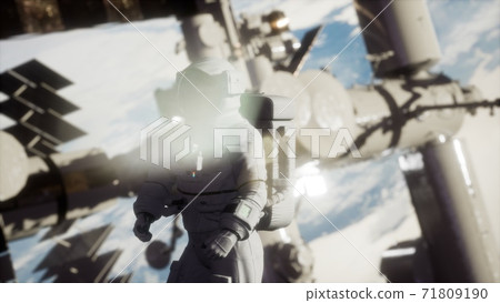 8K Astronaut outside the International Space Station on a spacewalk 71809190
