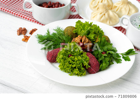 Traditional Georgian dish appetizer Phali served with salad leaves 71809806
