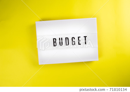 Budget word on lightbox, vintage billboard on yellow background 71810134