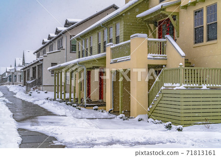 Pathway in front of cozy homes in Daybreak Utah viewed in winter Pathway in front of cozy homes in Daybreak Utah viewed in winter 71813161