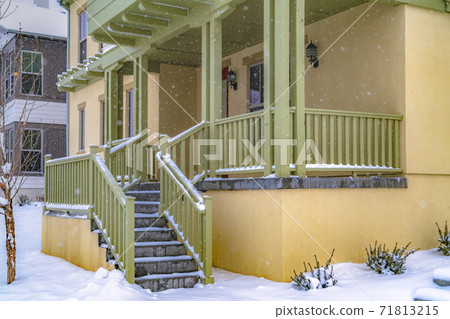 Stairs going to the front porch of a charming home in Daybreak Utah 71813215