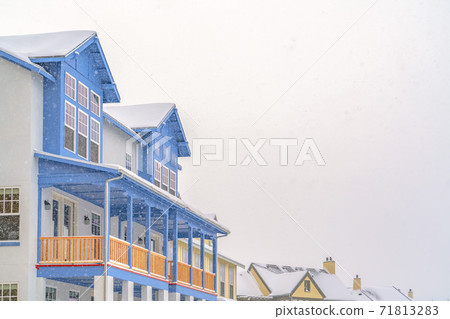 Exterior of an appealing home in Daybreak Utah against cloudy sky in winter 71813283