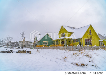 Appealing homes amid an icy landscape on a cloudy winter day in Daybreak 71813284