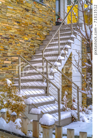 Snowy outdoor stairs of home in Daybreak Utah Snowy outdoor stairs of home in Daybreak Utah 71813512