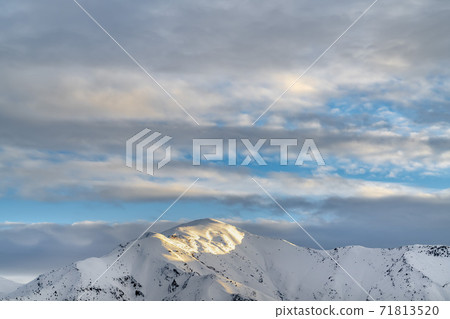 Remarkable sunlit mountain covered with powdery white snow in winter Remarkable sunlit mountain covered with powdery white snow in winter 71813520