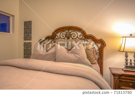 Bedroom interior with bed lamp side table square windows and wall decorations 71813780