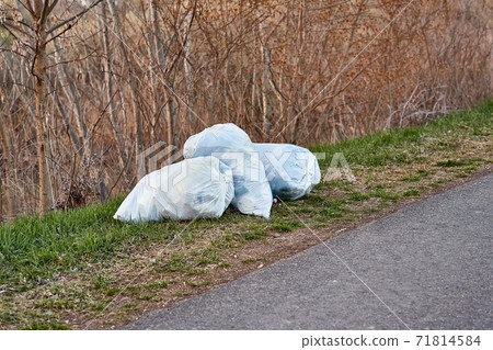 Bags of rubbish on the roadside Bags of rubbish on the roadside 71814584