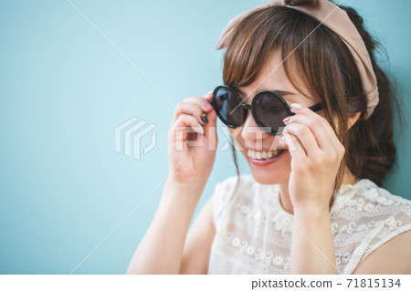 A woman wearing sunglasses A woman wearing sunglasses 71815134