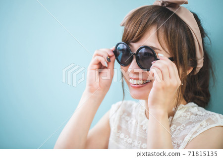 A woman wearing sunglasses A woman wearing sunglasses 71815135