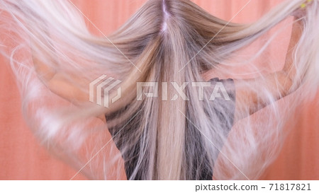 Beautiful healthy long straight blonde hair close up. Beautiful healthy long straight blonde hair close up. 71817821